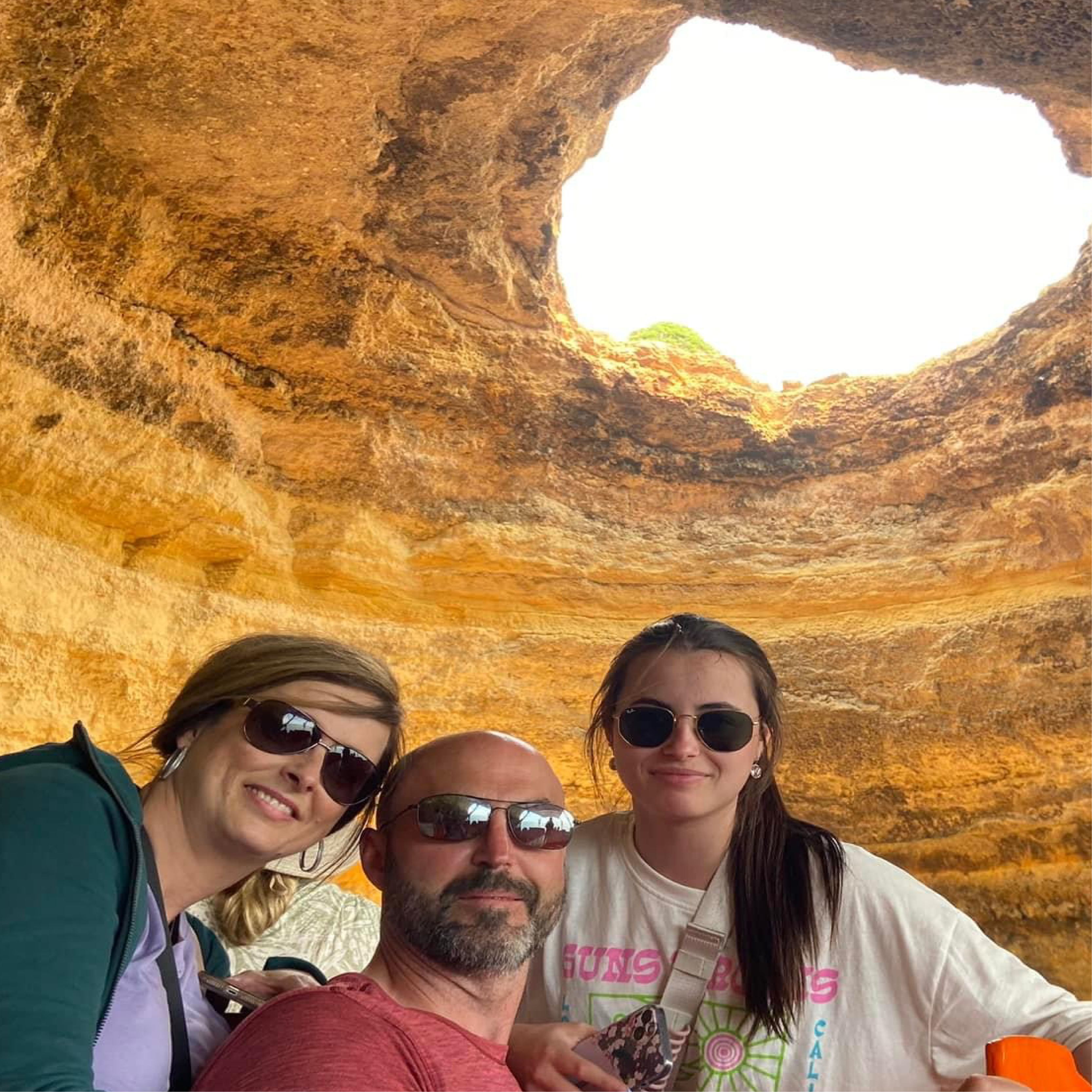 Interior view of Benagil Cave with the famous skylight opening and sandy beach in the Algarve, Portugal